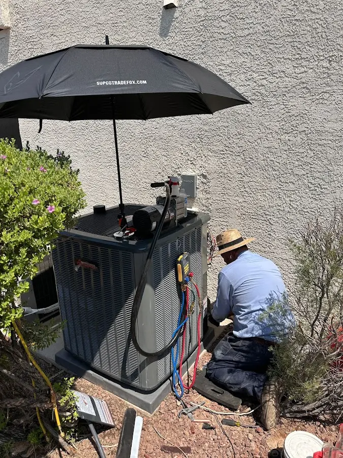 HVAC technician performing outdoor AC maintenance in Pleasant Hill